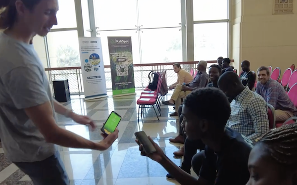 I give away free Bitcoin to conference-goers. As you can see from onlookers smiling away, it became part of the conference's entertainment