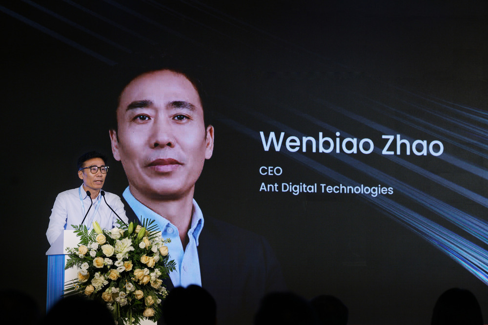 Ant Digital Technologies CEO Wenbiao Zhao speaking on stage.